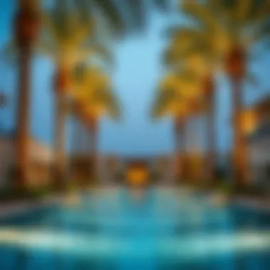 Luxurious swimming pool surrounded by palm trees at Azizi Royal Bay