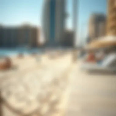 The vibrant beachfront with sun loungers and people enjoying the sunny day at Dubai Marina