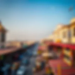 A panoramic view of the bustling Deira market showcasing traditional architecture and vibrant activity